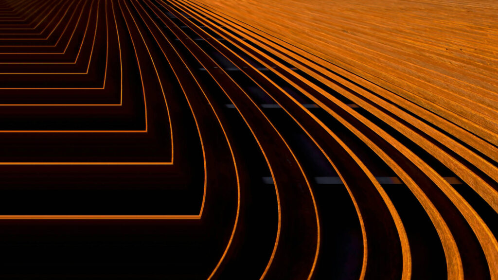 Abstract image of orange neon curves forming overlapping arches across a dark background with a sense of motion and depth.